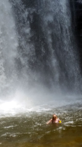 Karen Duquette in the water at Looking Glass Falls